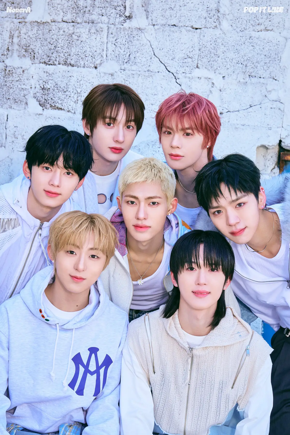 NouerA members are Hyunjun, Gihyeon, Junpyo, Yuseop, Lin, Fan, and Miraku.